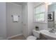 The powder room features a single sink vanity, tiled floors, and neutral paint at 802 Wakehurst Dr, Cary, NC 27519