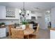 Cozy kitchen with white cabinets, stainless steel appliances, and a charming breakfast nook at 802 Wakehurst Dr, Cary, NC 27519