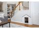 Cozy living room with staircase featuring a unique dog house at 802 Wakehurst Dr, Cary, NC 27519