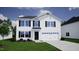 Charming two-story home with a garage, black shutters, and a well-manicured lawn at 83 Sagamore Avenue, Angier, NC 27501