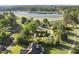 Picturesque aerial view of a home near the golf course and lake, surrounded by trees, offering a serene escape at 9 Lakeview Dr, Sanford, NC 27332