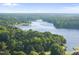 Aerial panorama of lake and surrounding lush green landscape at 9 Lakeview Dr, Sanford, NC 27332