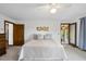 Bedroom with natural light, neutral tones, and access to multiple rooms at 9 Lakeview Dr, Sanford, NC 27332