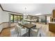 Open dining room and kitchen space with backyard view and stainless appliances at 9 Lakeview Dr, Sanford, NC 27332