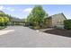 Driveway leads to a brick home with carport at 9 Lakeview Dr, Sanford, NC 27332