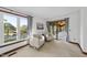Cozy sitting area with large windows, comfortable chairs, and access to an outdoor patio space at 9 Lakeview Dr, Sanford, NC 27332