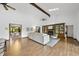 Spacious living room with fireplace, built-in shelves, and view into dining area at 9 Lakeview Dr, Sanford, NC 27332
