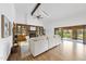 Bright living room features fireplace, built-in shelves, skylight, and sliding doors at 9 Lakeview Dr, Sanford, NC 27332