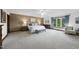 Spacious main bedroom with a carpet, a king bed, accent wall, ceiling fan, and natural light at 9 Lakeview Dr, Sanford, NC 27332