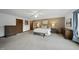 Bright main bedroom with carpet, a king bed, and a ceiling fan, offering a relaxing retreat at 9 Lakeview Dr, Sanford, NC 27332