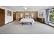 Large main bedroom featuring neutral colors, a comfortable king bed, and plenty of natural light at 9 Lakeview Dr, Sanford, NC 27332
