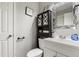 Cozy bathroom featuring a toilet, vanity, decorative storage cabinet, and framed mirror at 901 Currin Perry Rd, Zebulon, NC 27597