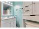 The bathroom features a vanity and medicine cabinet providing ample storage and counter space at 901 Currin Perry Rd, Zebulon, NC 27597