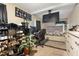 Comfortable bedroom with a bed, mounted TV, and lots of shoe storage in a well-lit room at 901 Currin Perry Rd, Zebulon, NC 27597