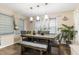 Elegant dining room with modern pendant lighting, a stylish wooden table, and decorative window treatments at 901 Currin Perry Rd, Zebulon, NC 27597