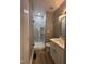 Updated bathroom featuring white marble shower, modern vanity, and new fixtures at 9013 Tenderfoot Trl, Raleigh, NC 27615