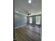 Spacious bedroom featuring neutral paint and plenty of natural light from the windows at 9013 Tenderfoot Trl, Raleigh, NC 27615
