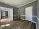 Bedroom featuring new floors, fresh paint, two closets, and two doors leading to other rooms at 9013 Tenderfoot Trl, Raleigh, NC 27615
