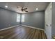 Comfortable bedroom with neutral color scheme and two bright windows at 9013 Tenderfoot Trl, Raleigh, NC 27615