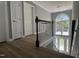 Welcoming entryway with a modern chandelier and grand staircase leading to the main level at 9013 Tenderfoot Trl, Raleigh, NC 27615