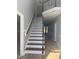 Bright entryway with hardwood floors, staircase, and view into adjacent living spaces at 9013 Tenderfoot Trl, Raleigh, NC 27615