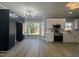 Modern kitchen featuring black and white cabinetry, a stylish light fixture, and a bright window view at 9013 Tenderfoot Trl, Raleigh, NC 27615