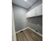 Functional laundry room equipped with upper cabinets and utility connections at 9013 Tenderfoot Trl, Raleigh, NC 27615