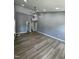 Spacious living room with high ceilings, modern ceiling fan, recessed lights, and wood-look flooring at 9013 Tenderfoot Trl, Raleigh, NC 27615