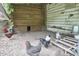Rustic chicken coop exterior with free-range chickens and a wooden wall adding charm at 909 Goodwin Rd, Durham, NC 27712
