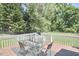 Outdoor deck space featuring a dining table with four chairs at 909 Goodwin Rd, Durham, NC 27712