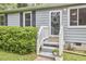 Welcoming front porch with classic details and well-maintained landscaping at 909 Goodwin Rd, Durham, NC 27712