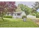 Charming single-story home with a well-manicured lawn and detached garage at 909 Goodwin Rd, Durham, NC 27712