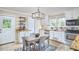 Charming eat-in kitchen featuring white cabinetry and stainless steel appliances at 909 Goodwin Rd, Durham, NC 27712