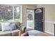 Bright living room with large window, hardwood floors and cozy decor at 909 Goodwin Rd, Durham, NC 27712