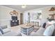 Open living space with hardwood floors leading into the kitchen area at 909 Goodwin Rd, Durham, NC 27712