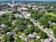 A wide aerial view of the city, featuring tree-lined streets, buildings, and a baseball field at 913 Washington St, Durham, NC 27701