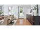 A well-decorated dining room features a wood dining table, stylish buffet, and bright natural lighting at 913 Washington St, Durham, NC 27701