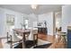 Dining room with modern decor, wood table, and view into kitchen at 913 Washington St, Durham, NC 27701