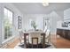 Well-lit dining room with a modern table set, hardwood floors, and an elegant décor at 913 Washington St, Durham, NC 27701
