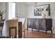 A modern dining room features a dark wood buffet with decorative accents and stylish decor at 913 Washington St, Durham, NC 27701