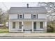 Charming two-story home featuring a classic design, covered porch, and fresh landscaping at 913 Washington St, Durham, NC 27701