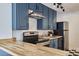 Galley kitchen with black appliances and countertops at 913 Washington St, Durham, NC 27701