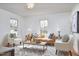 Bright and airy living room with neutral tones, hardwood floors and plenty of natural light at 913 Washington St, Durham, NC 27701