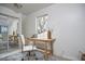 Bright office space with natural light, a modern desk, a comfortable chair, and ample storage in the mirrored closet at 913 Washington St, Durham, NC 27701