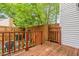Backyard featuring a wooden deck, fence, and trees at 919 Lexington Ct, Cary, NC 27511