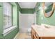 Bathroom featuring an enclosed shower-tub and a wood vanity at 919 Lexington Ct, Cary, NC 27511