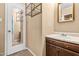Bathroom with a wood vanity, mirror, and door to another room at 919 Lexington Ct, Cary, NC 27511
