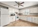 Functional kitchen with white cabinets, appliances, ample counter space, and tile flooring at 919 Lexington Ct, Cary, NC 27511