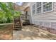 Inviting backyard features a wooden deck, stairs, and a concrete patio, perfect for outdoor relaxation at 100 Full Moon Ct, Garner, NC 27529