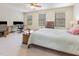 Spacious bedroom with carpet floors, natural light, and ample desk space at 100 Full Moon Ct, Garner, NC 27529
